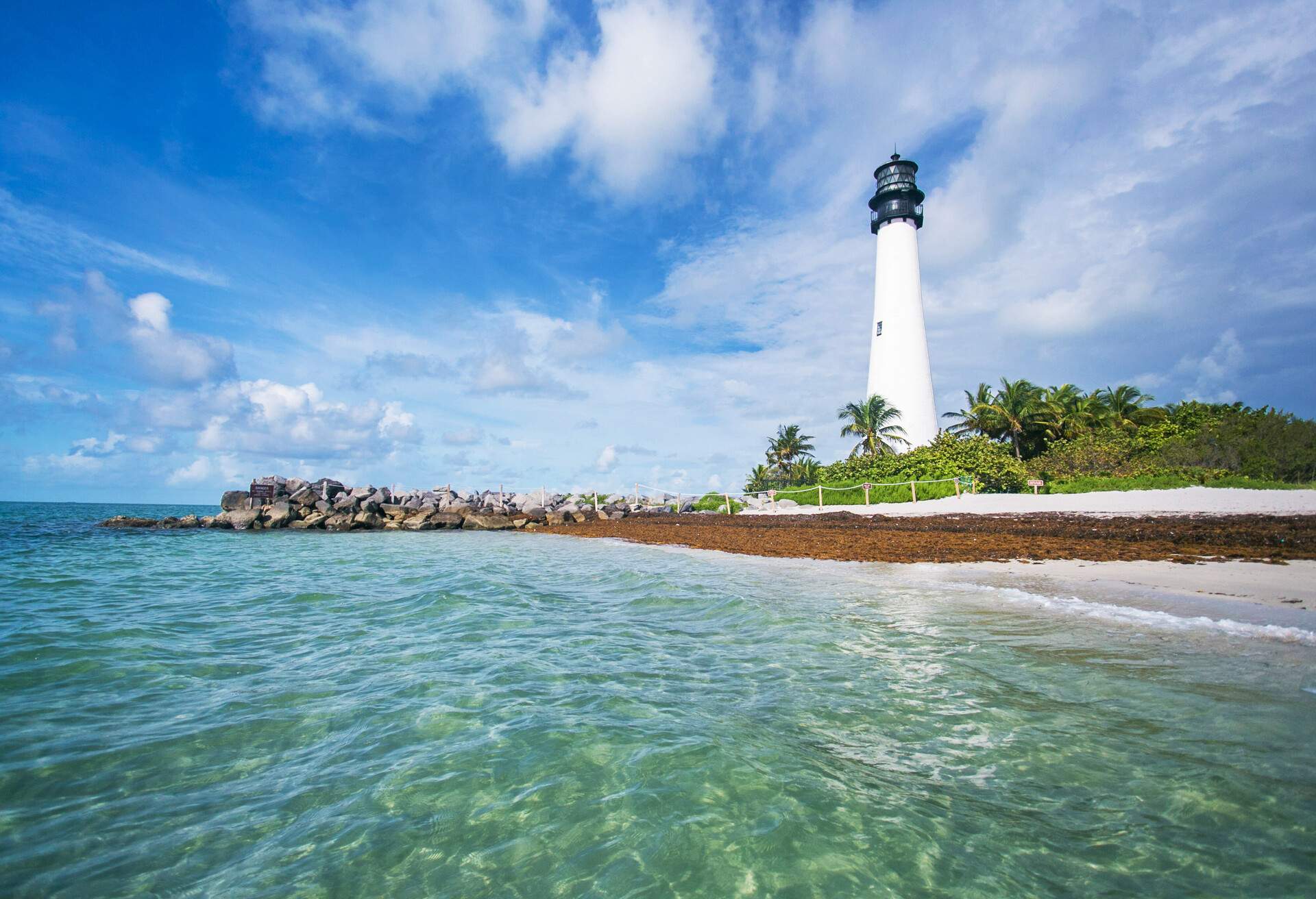 The lighthouse overlooking the waters of Miami in Key Biscayne, FL